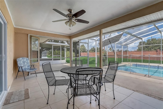 2800 Woodsmere Ct, Kissimmee, FL 34746 - sunroom featuring ceiling fan, healthy amount of natural light, and outdoor dining space