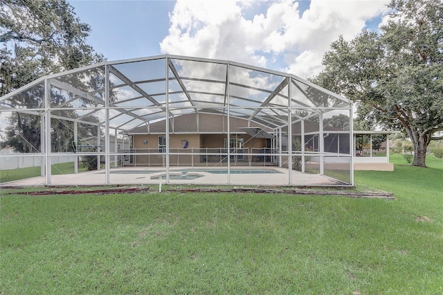 2800 Woodsmere Ct, Kissimmee, FL 34746 - back of property featuring an outdoor pool, a yard, and a patio area