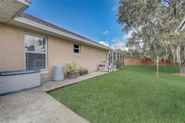2800 Woodsmere Ct, Kissimmee, FL 34746 - view of grassy yard featuring a patio area