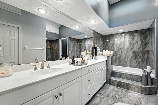 1769 Turnberry Ter, Orlando, FL 32804 - full bath with double vanity, tiled tub, marble finish floors, and a shower