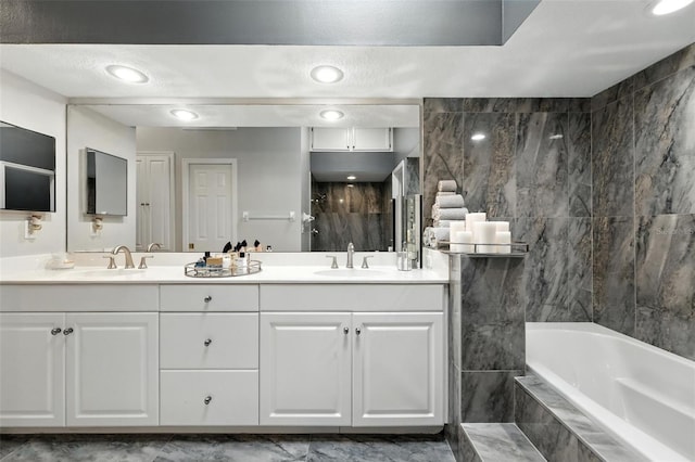 1769 Turnberry Ter, Orlando, FL 32804 - bathroom featuring a shower, double vanity, and tiled tub