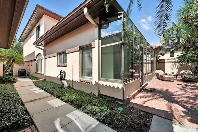 1769 Turnberry Ter, Orlando, FL 32804 - view of side of property with stucco siding and a patio area