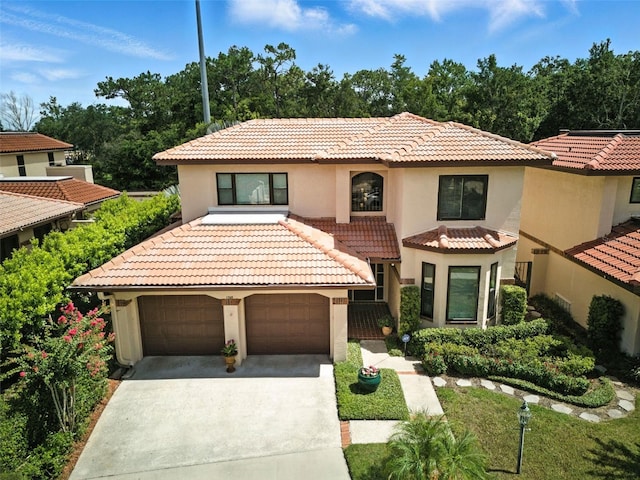 1769 Turnberry Ter, Orlando, FL 32804 - mediterranean / spanish-style house featuring a tiled roof, a garage, stucco siding, and concrete driveway