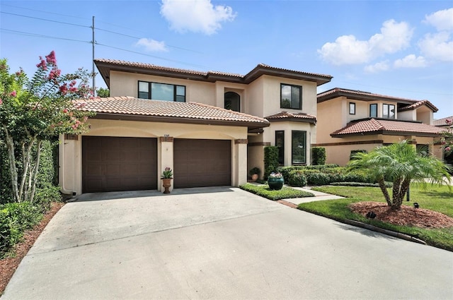1769 Turnberry Ter, Orlando, FL 32804 - mediterranean / spanish home with stucco siding, driveway, a garage, and a tile roof