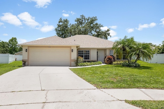 14301 Bending Branch Ct, Orlando, FL 32824 - single story home featuring stucco siding, a garage, and driveway