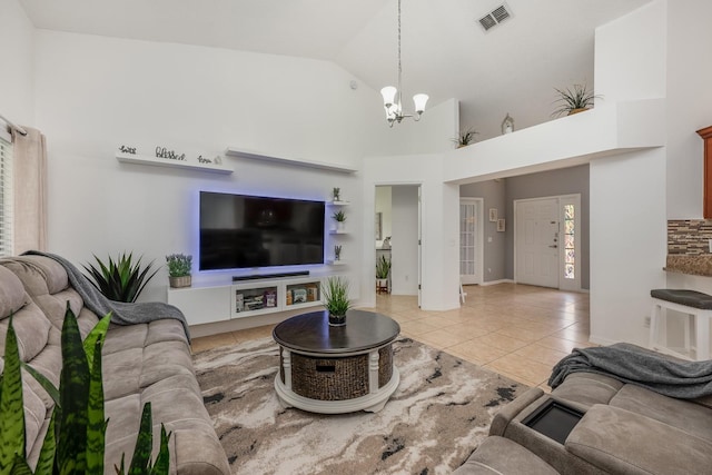 14301 Bending Branch Ct, Orlando, FL 32824 - living area featuring a chandelier, light tile patterned flooring, and high vaulted ceiling