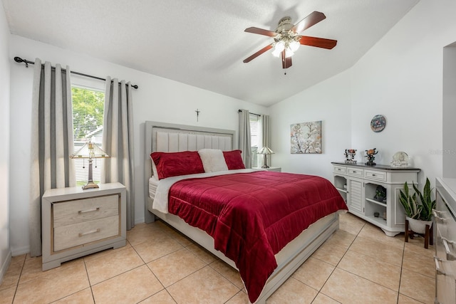 14301 Bending Branch Ct, Orlando, FL 32824 - bedroom featuring vaulted ceiling, light tile patterned floors, and a ceiling fan