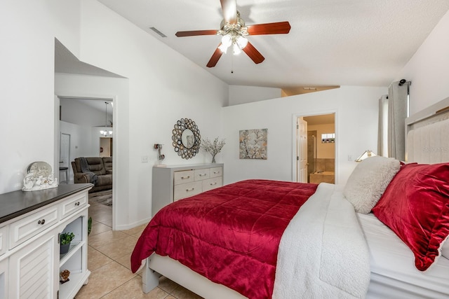 14301 Bending Branch Ct, Orlando, FL 32824 - bedroom featuring vaulted ceiling, ensuite bathroom, light tile patterned flooring, and a ceiling fan