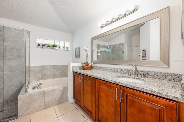14301 Bending Branch Ct, Orlando, FL 32824 - bathroom featuring vanity, a garden tub, tile patterned floors, tiled shower, and vaulted ceiling
