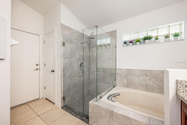 14301 Bending Branch Ct, Orlando, FL 32824 - bathroom featuring a garden tub, a shower stall, tile patterned floors, and vanity