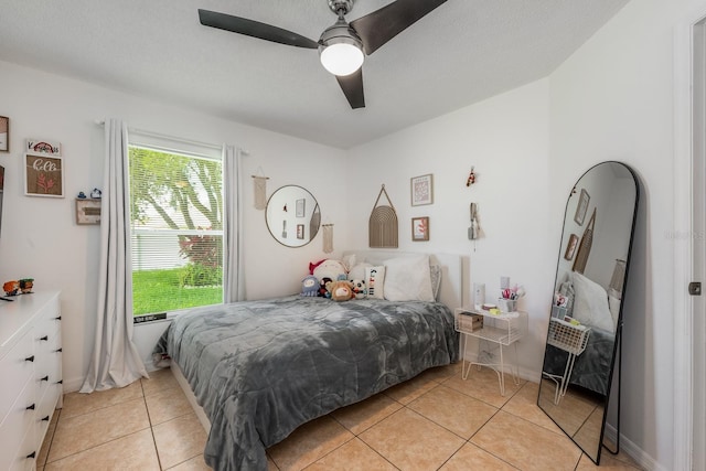 14301 Bending Branch Ct, Orlando, FL 32824 - bedroom with light tile patterned floors and a ceiling fan