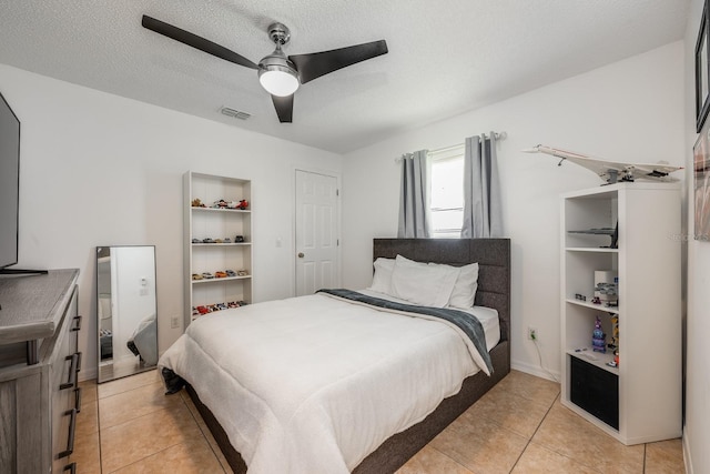 14301 Bending Branch Ct, Orlando, FL 32824 - bedroom featuring light tile patterned floors and ceiling fan