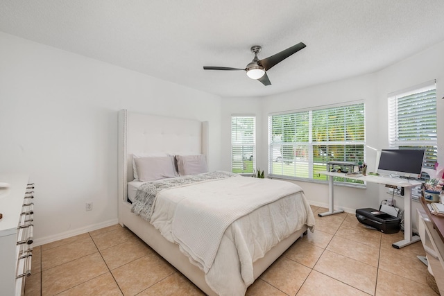 14301 Bending Branch Ct, Orlando, FL 32824 - bedroom featuring light tile patterned flooring and ceiling fan