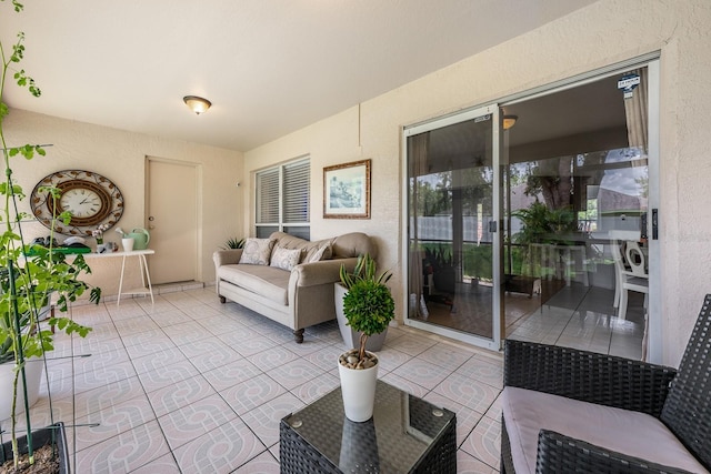 14301 Bending Branch Ct, Orlando, FL 32824 - living room featuring a textured wall and tile patterned floors