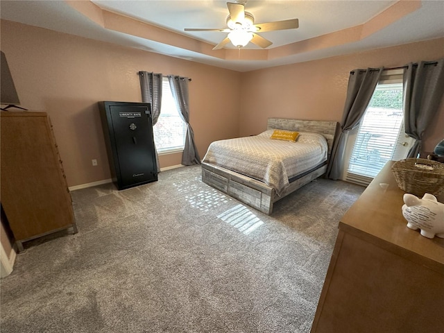 1140 Odoniel Loop S, Lakeland, FL 33809 - carpeted bedroom featuring a raised ceiling and a ceiling fan