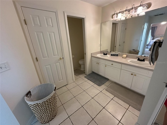 1140 Odoniel Loop S, Lakeland, FL 33809 - ensuite bathroom featuring double vanity and tile patterned flooring