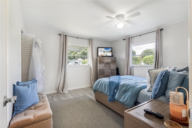 1501 SW 18th Dr, Boynton Beach, FL 33426 - bedroom with multiple windows, wood finished floors, and a ceiling fan