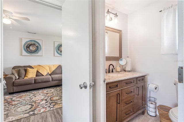 1501 SW 18th Dr, Boynton Beach, FL 33426 - bathroom with vanity, ceiling fan, and wood finished floors