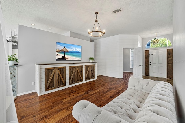 28707 Raleigh Pl, Wesley Chapel, FL 33545 - living area with a chandelier, a textured ceiling, wood finished floors, and recessed lighting