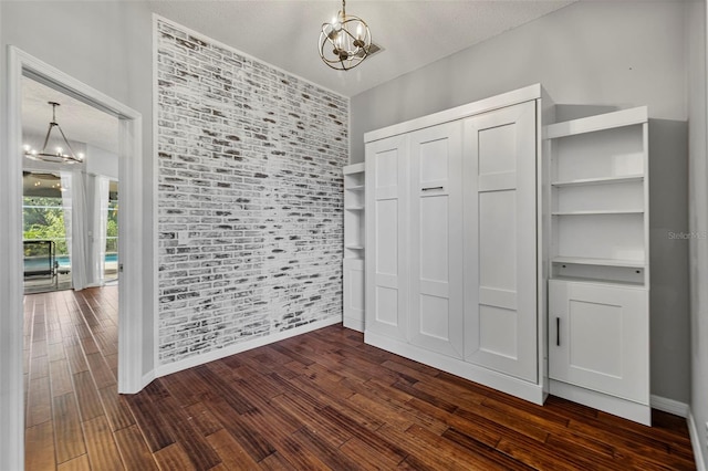 28707 Raleigh Pl, Wesley Chapel, FL 33545 - interior space with a chandelier, dark wood-style flooring, and a closet