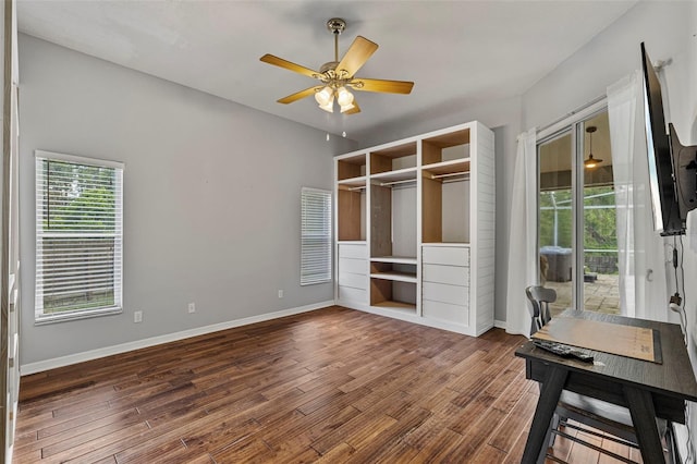 28707 Raleigh Pl, Wesley Chapel, FL 33545 - unfurnished bedroom featuring wood finished floors, access to outside, a ceiling fan, and a closet