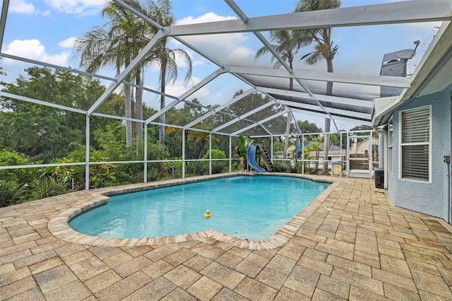 28707 Raleigh Pl, Wesley Chapel, FL 33545 - swimming pool with a water slide, a patio, and a lanai