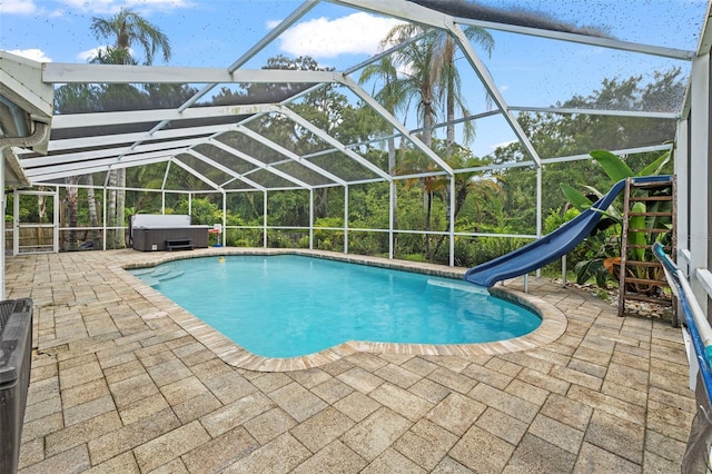 28707 Raleigh Pl, Wesley Chapel, FL 33545 - swimming pool featuring a hot tub, a water slide, a patio area, and a lanai