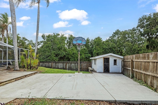 28707 Raleigh Pl, Wesley Chapel, FL 33545 - fenced backyard with a patio, view of wooded area, and a storage unit