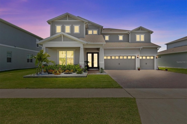 3179 Sailing Pier Ave, Winter Garden, FL 34787 - view of front of home with driveway, a lawn, french doors, and a shingled roof