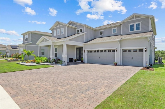 3179 Sailing Pier Ave, Winter Garden, FL 34787 - view of front of house featuring decorative driveway, a front yard, stucco siding, and an attached garage