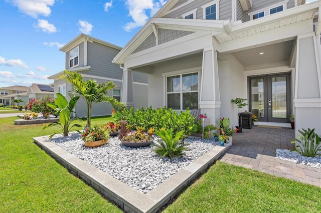 3179 Sailing Pier Ave, Winter Garden, FL 34787 - view of side of property featuring french doors, a yard, and stucco siding
