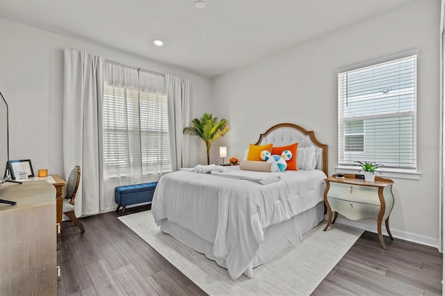 3179 Sailing Pier Ave, Winter Garden, FL 34787 - bedroom with multiple windows, wood finished floors, and an office area
