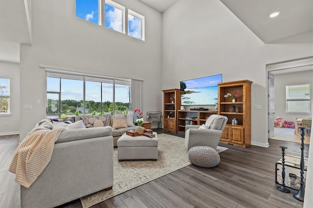 3179 Sailing Pier Ave, Winter Garden, FL 34787 - living room with a towering ceiling, dark wood finished floors, plenty of natural light, and recessed lighting