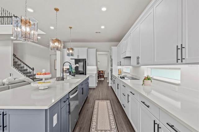 3179 Sailing Pier Ave, Winter Garden, FL 34787 - kitchen featuring white cabinets, light countertops, dark wood finished floors, a chandelier, and recessed lighting