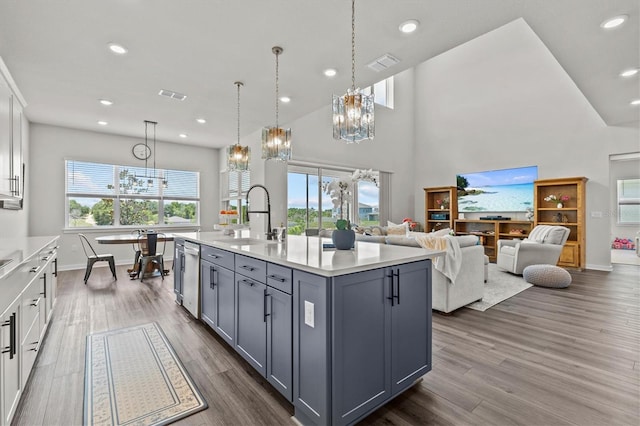 3179 Sailing Pier Ave, Winter Garden, FL 34787 - kitchen featuring a chandelier, gray cabinets, light countertops, white cabinetry, and dark wood-style floors