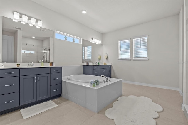 3179 Sailing Pier Ave, Winter Garden, FL 34787 - bathroom featuring a shower stall, healthy amount of natural light, a garden tub, and two vanities