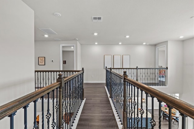 3179 Sailing Pier Ave, Winter Garden, FL 34787 - hallway with dark wood-type flooring, recessed lighting, and an upstairs landing