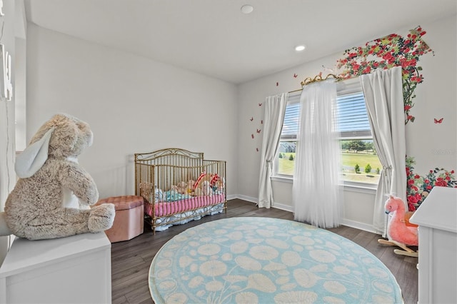3179 Sailing Pier Ave, Winter Garden, FL 34787 - bedroom featuring dark wood-style flooring, a crib, and recessed lighting