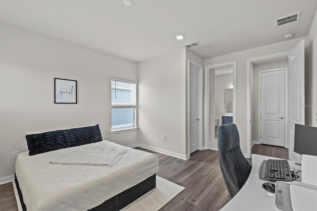 3179 Sailing Pier Ave, Winter Garden, FL 34787 - bedroom featuring dark wood finished floors, connected bathroom, a desk, and recessed lighting