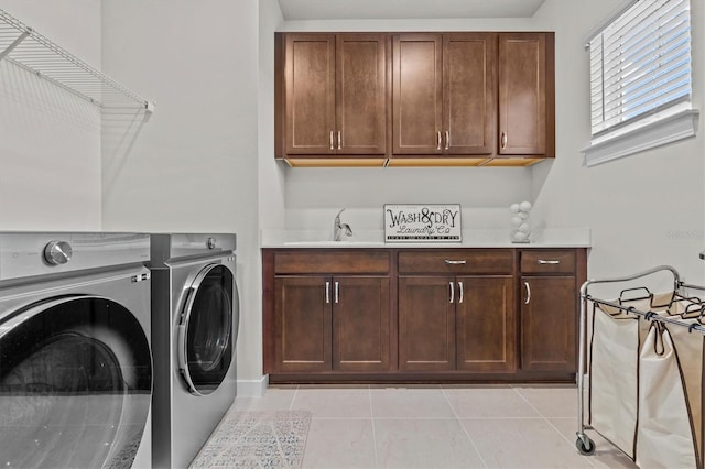 3179 Sailing Pier Ave, Winter Garden, FL 34787 - washroom with cabinet space, separate washer and dryer, and light tile patterned floors