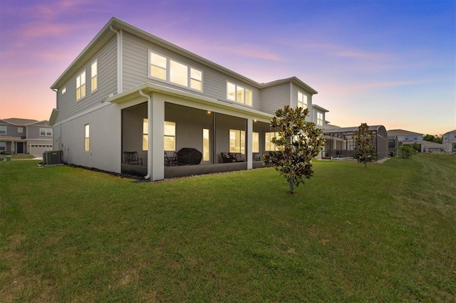 3179 Sailing Pier Ave, Winter Garden, FL 34787 - back of house at dusk featuring a yard