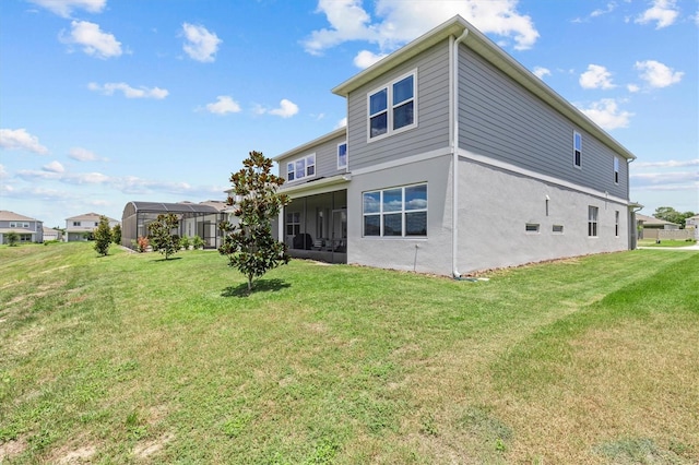 3179 Sailing Pier Ave, Winter Garden, FL 34787 - rear view of house featuring a yard, stucco siding, and a sunroom