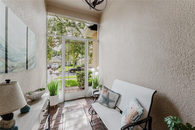 2173 Caledonian St, Clermont, FL 34711 - doorway to outside featuring a textured wall and brick patterned floors