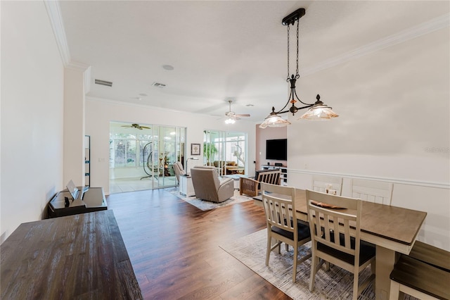 2173 Caledonian St, Clermont, FL 34711 - dining space featuring ceiling fan, ornamental molding, and wood finished floors