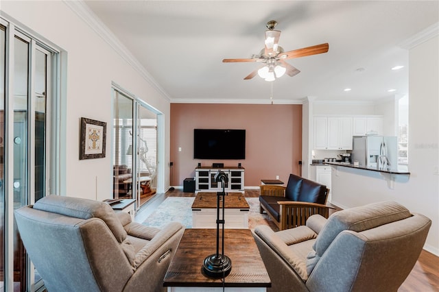 2173 Caledonian St, Clermont, FL 34711 - living room with light wood-style floors, a ceiling fan, crown molding, and recessed lighting