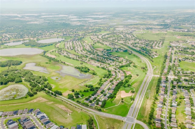 2173 Caledonian St, Clermont, FL 34711 - aerial view of property and surrounding area with a large body of water and a local golf course