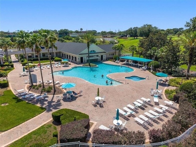 2173 Caledonian St, Clermont, FL 34711 - community pool featuring a patio and view of wooded area
