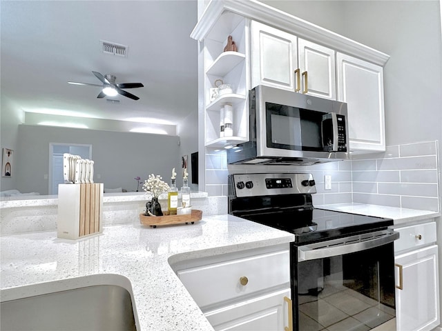 5205 Hammock Cir, Saint Cloud, FL 34771 - kitchen featuring stainless steel appliances, white cabinetry, tasteful backsplash, ceiling fan, and light stone counters
