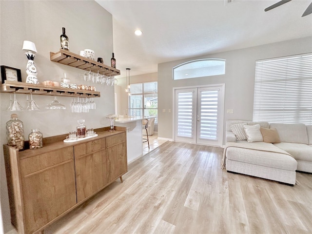 5205 Hammock Cir, Saint Cloud, FL 34771 - living room featuring a dry bar, light wood finished floors, a ceiling fan, french doors, and recessed lighting