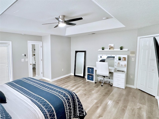 5205 Hammock Cir, Saint Cloud, FL 34771 - bedroom with light wood-type flooring, a desk, a ceiling fan, and a textured ceiling